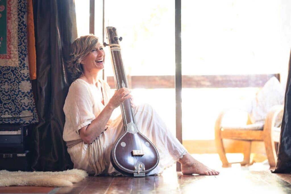 Lorraine Taylor Yoga teacher with her Tambura
